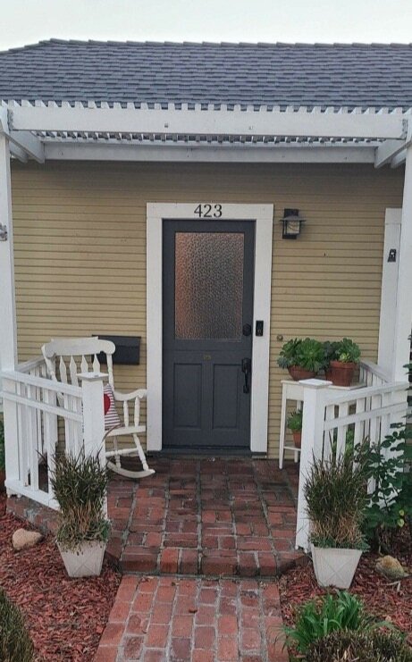 Front door with textured glass insert in top half
